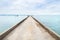 Concrete jetty on the beach into the sea