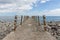 Concrete jetty and iron fence with ropes