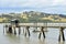 Concrete jetty in muddy harbor