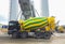 Concrete mixer truck in front of a concrete batching plant, cement factory