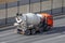 Concrete mixer truck rides on city highway