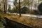 Concrete path along ditch in sunny winter afternoon