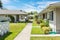 Concrete pathway through residential community of duplex houses