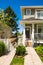 Concrete pathway to the entrance of brand new townhouse on sunny day in Canada.