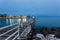 Concrete pier leading to boat entrance to lake Michigan with park in background