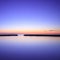 Concrete pier silhouette and blue ocean on twilight sunset