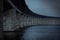 The concrete pillars holding up the Ã–resund bridge on a dark gloomy day by the sea in MalmÃ¶, Sweden