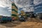 Concrete Plant. Several concrete truck vehicles are awaiting loading near cement storage towers.