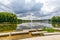 Concrete platforms on shore of Lake Echternach with waterjet gushing from a fountain