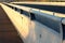 Concrete road bridge barrier with metal guard rails