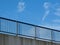 Concrete rod highway with steel guardrail and blue sky