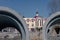 Concrete sewer pipes on the background of the church parish school