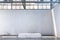 Concrete Showcase In Enlightened White Hangar, Empty Factory Interior or Warehouse With Concrete Floor.