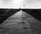 Concrete slabs road in northern Poland. Black and white dramatic high detail image.