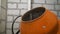 Concrete in a small concrete mixer. orange concrete mixer for the construction and repair of the house and the ingredients for the