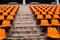 Concrete stair and orange seat in stadium