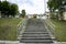 Concrete staircase with rubber treads on a summer day.