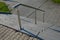 Concrete staircase with stainless steel polished tubular railing. cobblestones cobblestones concrete. screwed to the groung, detai