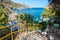 Concrete stairs with rails to small beach in Anthony Quinn bay Rhodes, Greece