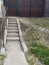 Concrete steps and metal handrail made of pipe