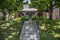 Concrete steps up to charming house on hill under magnolia trees - selective focus on steps