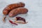On the concrete table, there is a tree-shaped Nduja sausage