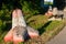 Concrete tetrapods lying in meadow alongside street