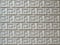 Concrete wall with carved seamless geometric pattern