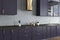 Concrete wall kitchen, purple countertops close up