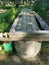 Concrete wall with zinc sheet on top to collect rain water at the farm