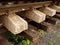 Concrete and wooden sleepers extracted with rail rods in railway station stock waiting for transport to steel foundry