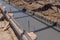 Concreting the base of the building. Construction worker Concrete pouring during commercial concreting floors of building in