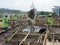 Concreting work by construction workers at the construction site.