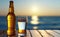 The condensation filled beer glass and the open beer bottle on the hardwood table. Generative AI