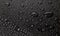 Condensation water drops on black glass background. Rain droplets with on dark surface. Abstract wet texture