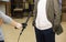 Condenser Shotgun Microphone. A woman interviews a man. The microphone in the reporter`s hand