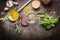 Condiments and spices for creative cooking on dark rustic wooden background, top view