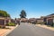 Condominiums with garage in the front, and garbage wheelie bins on the street, California