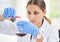 Conducting tests to build better insights. a young female scientist conducting an experiment in a lab.