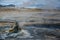 Cone in Hverir geothermal area with boiling mudpools and steaming fumaroles in Iceland in summer.  Myvatn region, North part of