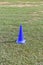 Cone markers on the green grass playground