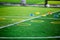 Cone and ring ladder marker are soccer training equipment on green artificial turf