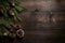 Cones and fir tree branches on dark wooden table. Christmas flat lay background with copy space