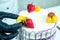 Confectioner in black gloves and white work uniform adorns the cake in the kitchen. confectioner, cake, cooking. wedding