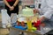 Confectioner hands puts cream on child birthday dessert cake