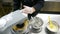 A confectioner mixing some ingredients with a stand mixer