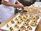 Confectioner prepares cakes