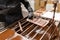 Confectioner removing excess chocolate from mold