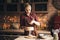 Confectioner sprinkling flour on gingerbread dough