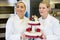 Confectioners or bakers presenting wedding cake